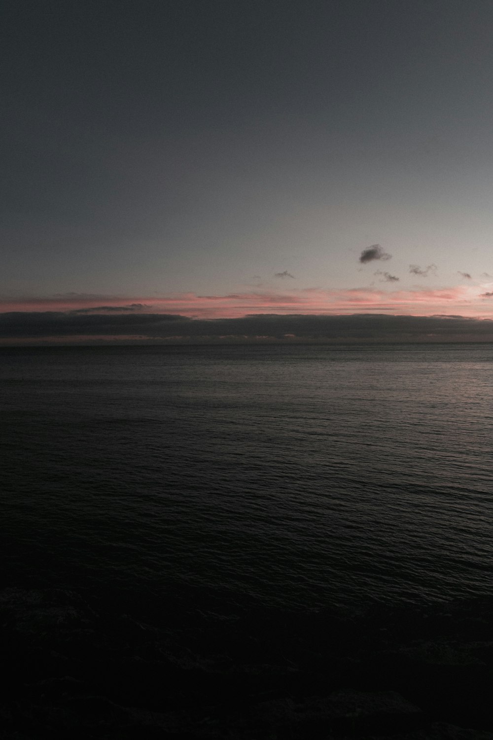 body of water during sunset