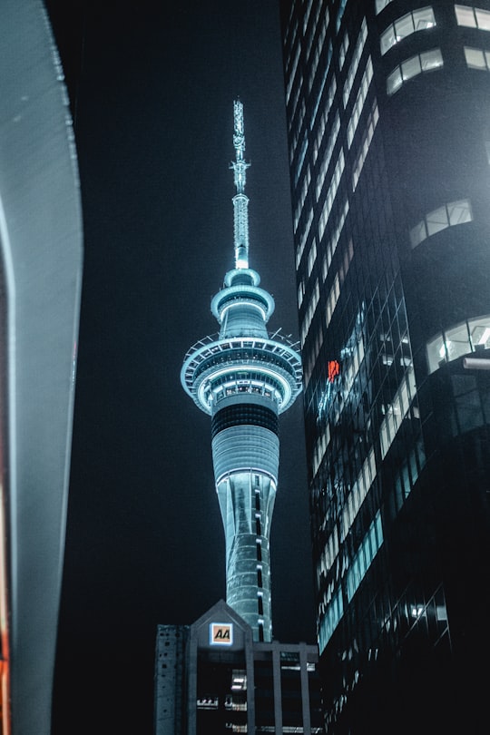 white concrete tower during night time in Sky Tower New Zealand