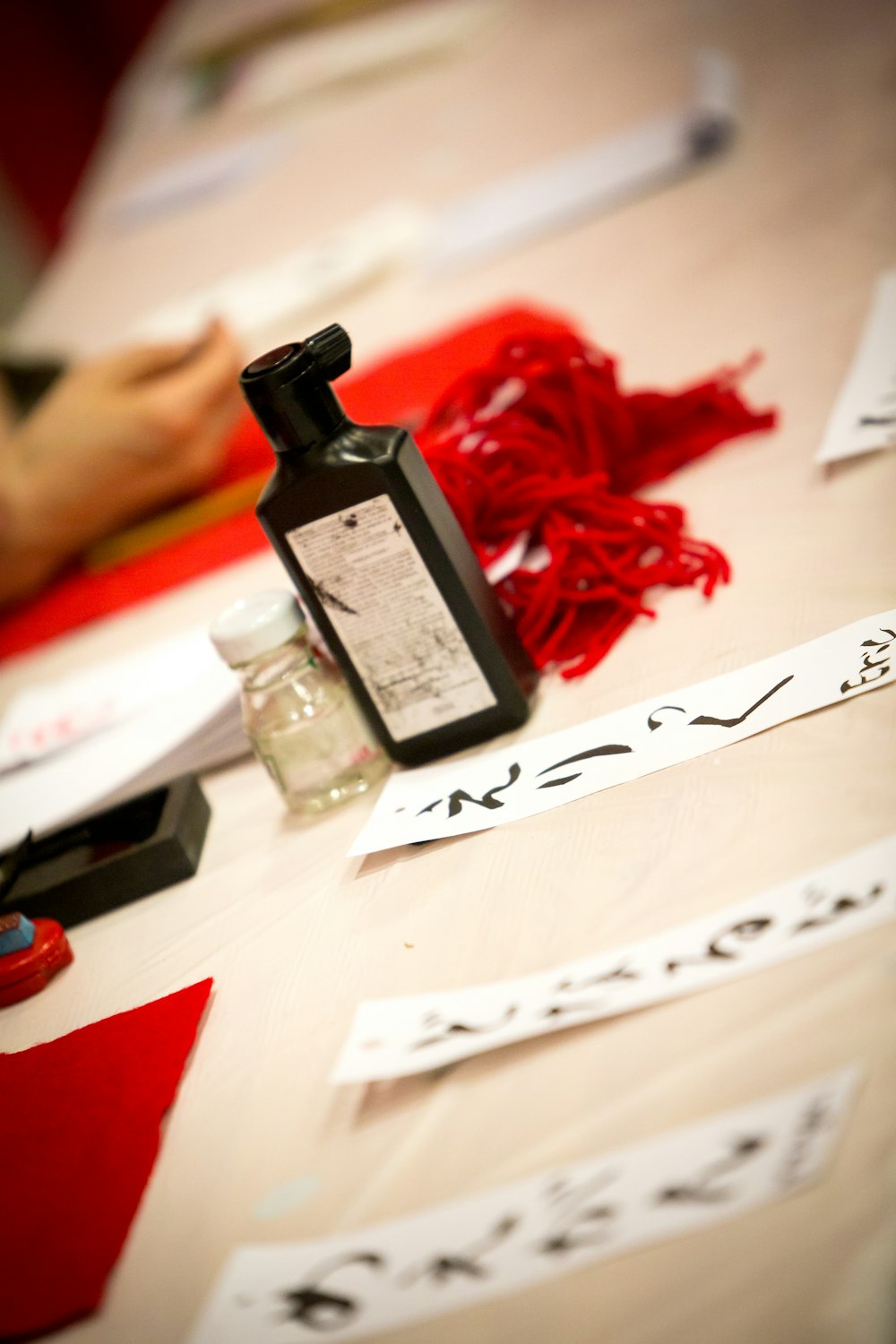 black and white labeled bottle on white printer paper