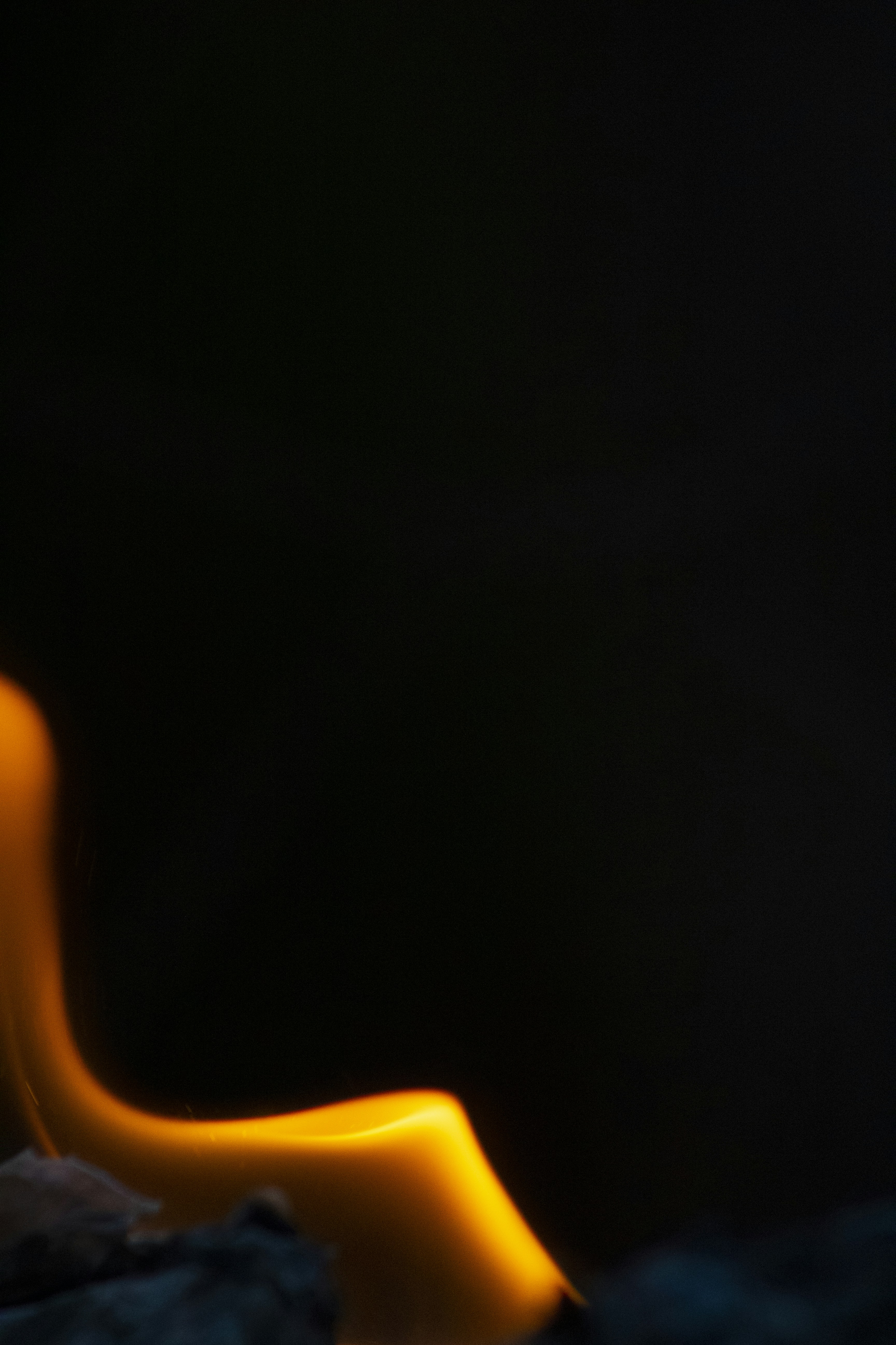persons finger in dark room