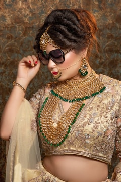 woman in white lace dress wearing black sunglasses