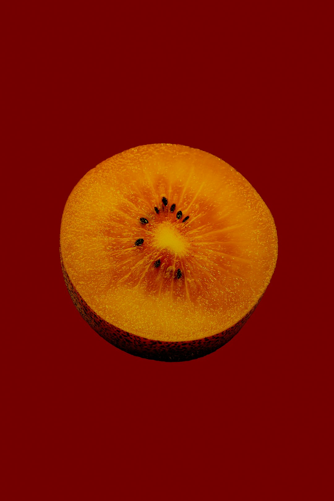 yellow round fruit with black background