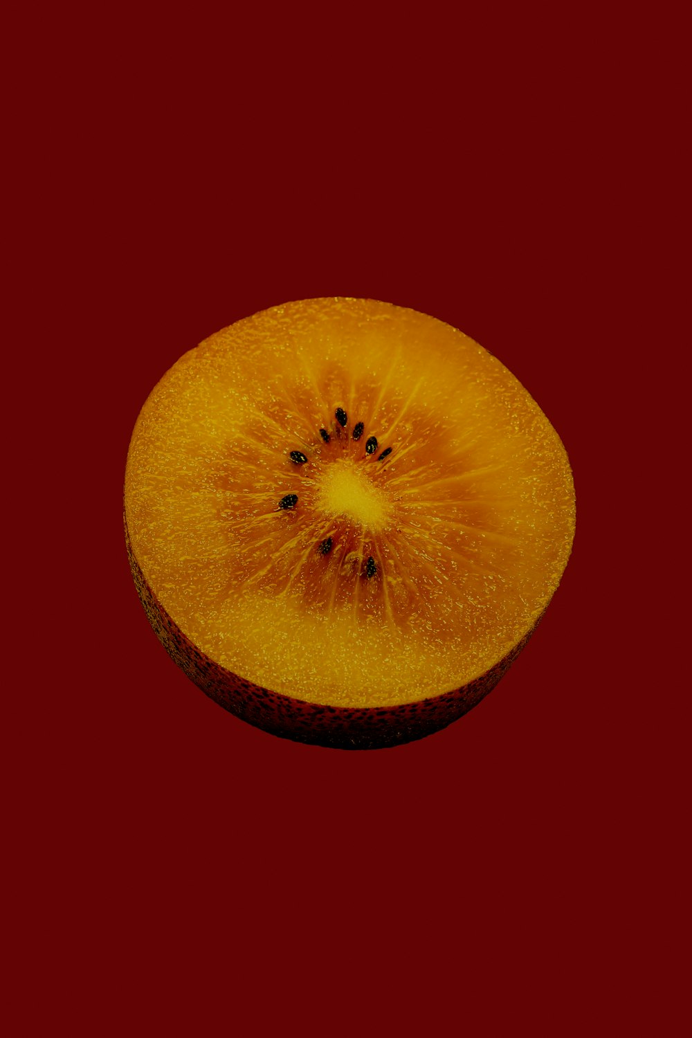 yellow round fruit with black background