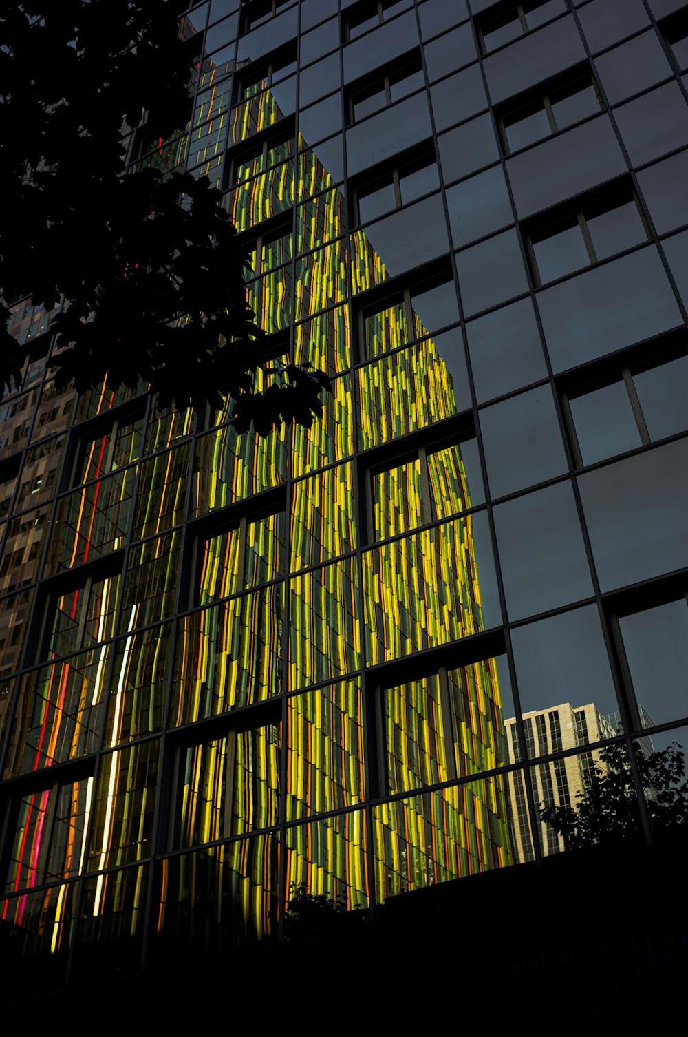 grayscale photo of glass window building