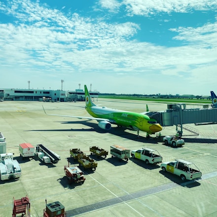 A large airplane at a colorful airport.