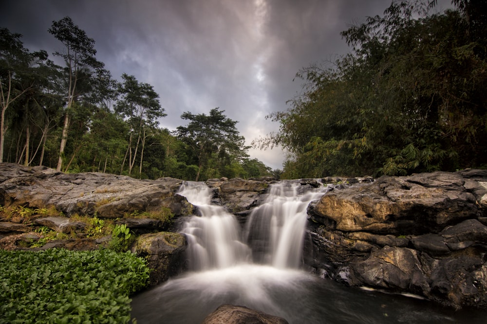 waterfalls under gray cloudy sky