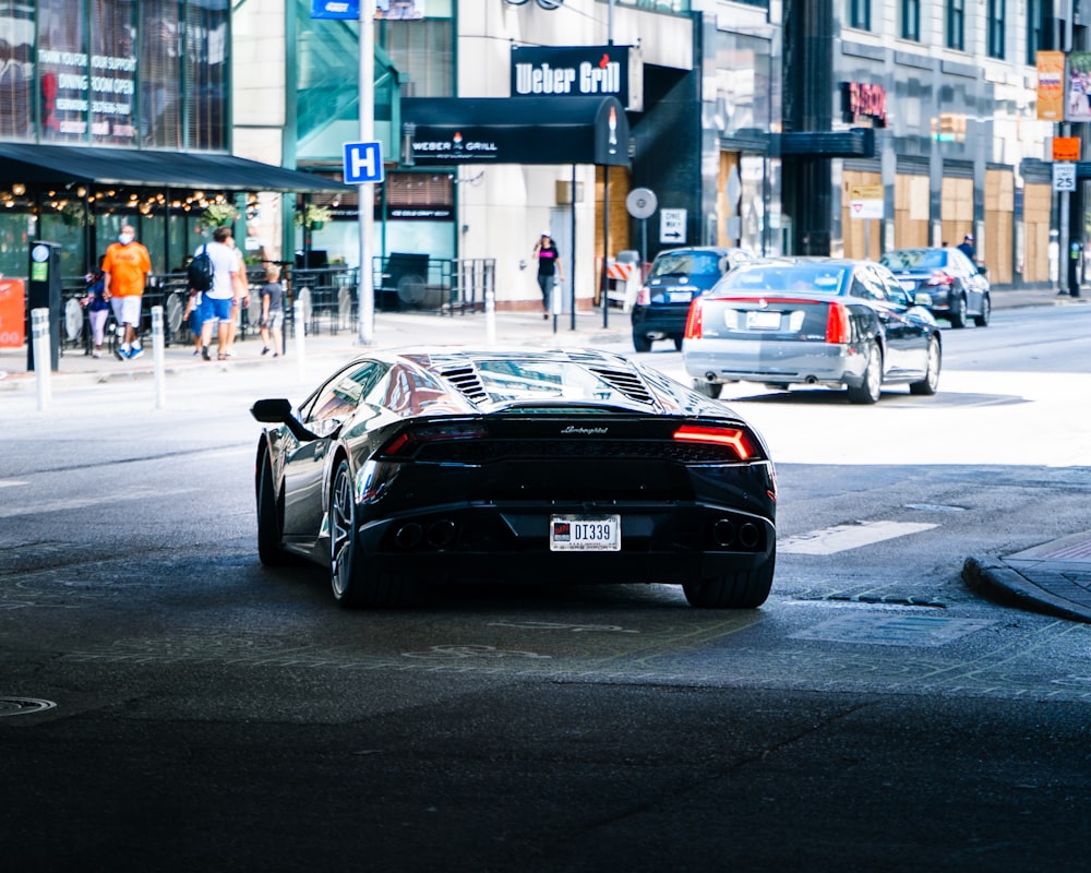 black porsche 911 parked on street during daytime