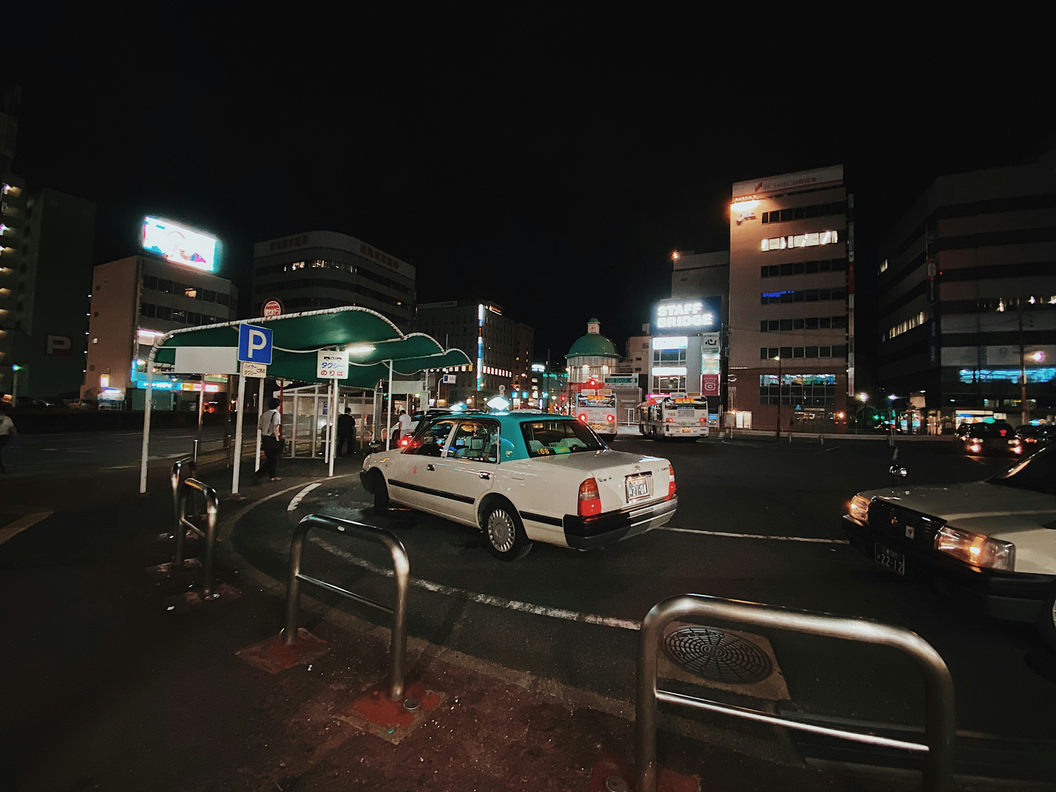 Long queue at a taxi stand in a Japanese city at night