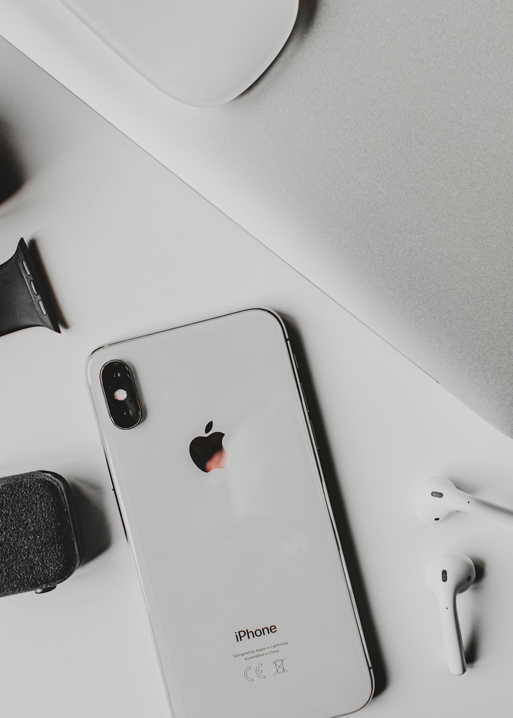 silver iphone 6 on white table