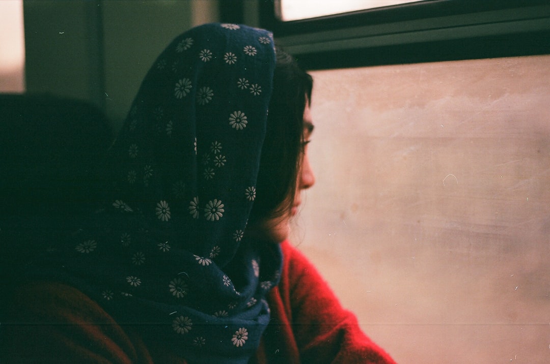 woman in black and white floral hijab