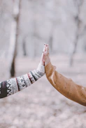 person in white red and black tribal print long sleeve shirt