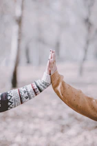 person in white red and black tribal print long sleeve shirt