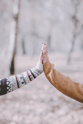 person in white red and black tribal print long sleeve shirt