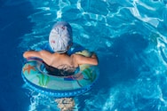 woman in blue swimming cap in pool