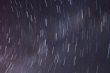 Time-lapse photo showing star trails circling around the North Star.