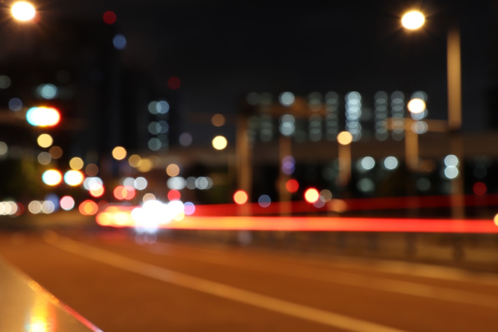 red and white light streaks of city buildings during night time