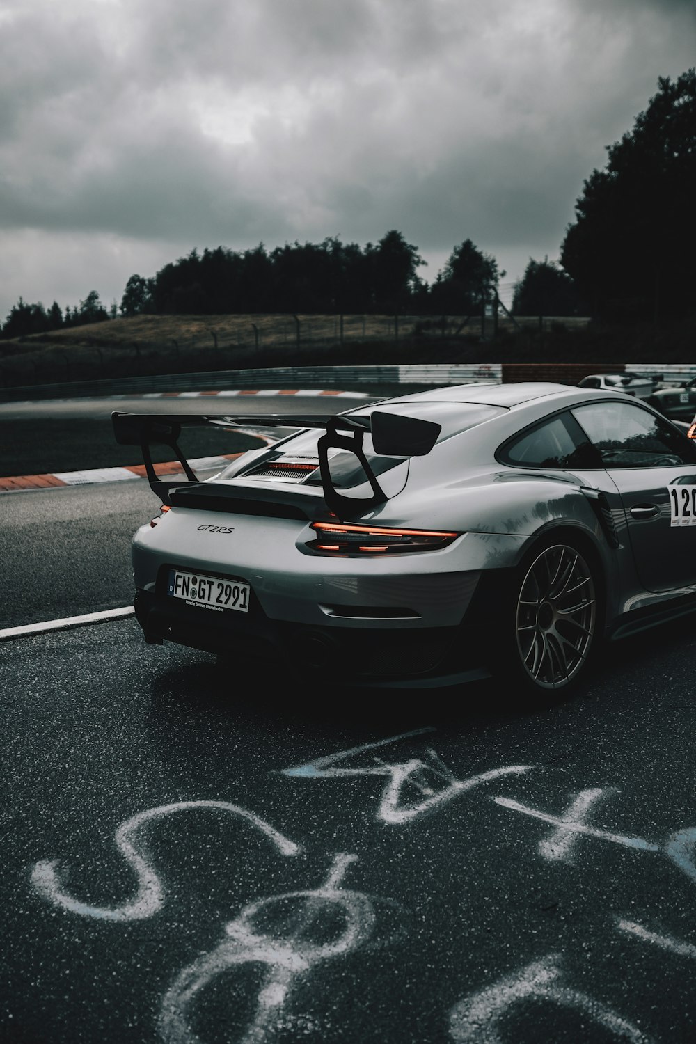 white porsche 911 on road during daytime