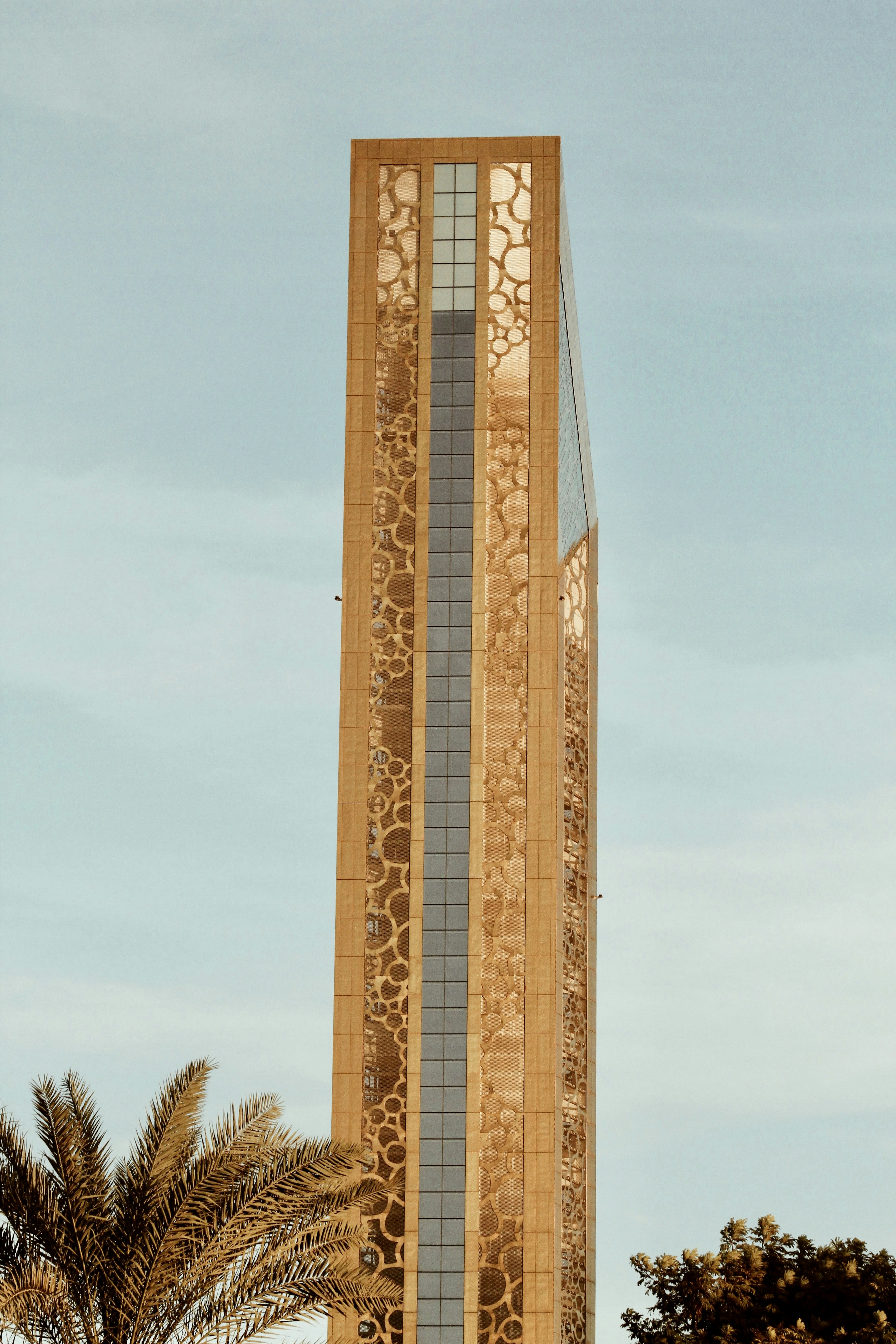 brown and white concrete building under blue sky during daytime
