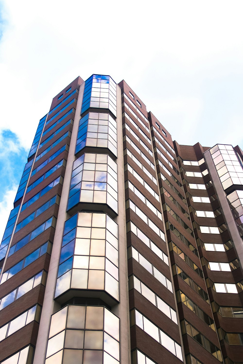 white and black concrete building under blue sky during daytime