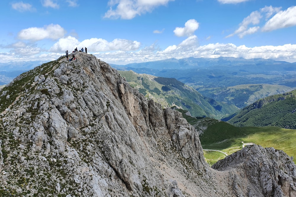 person standing on rock formation during daytime