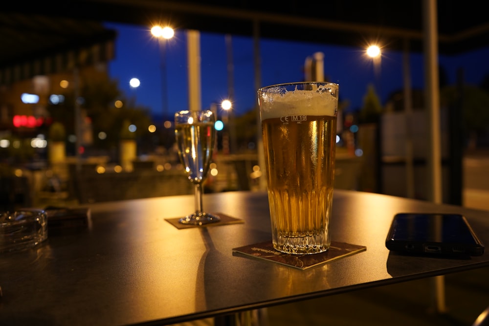 clear drinking glass on brown wooden table