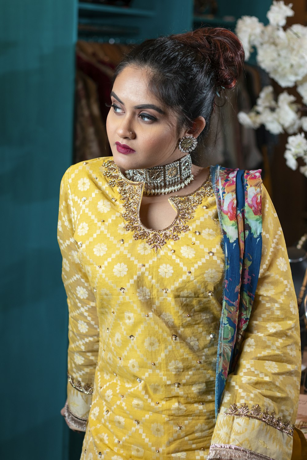 woman in yellow and white floral long sleeve dress