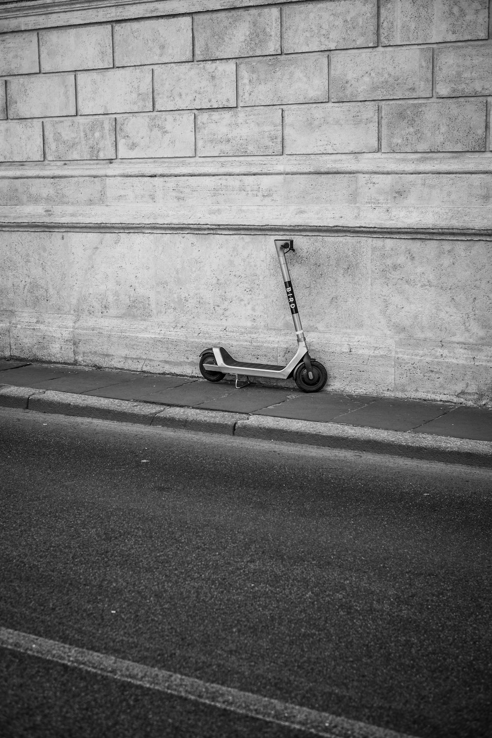 black and white kick scooter on road