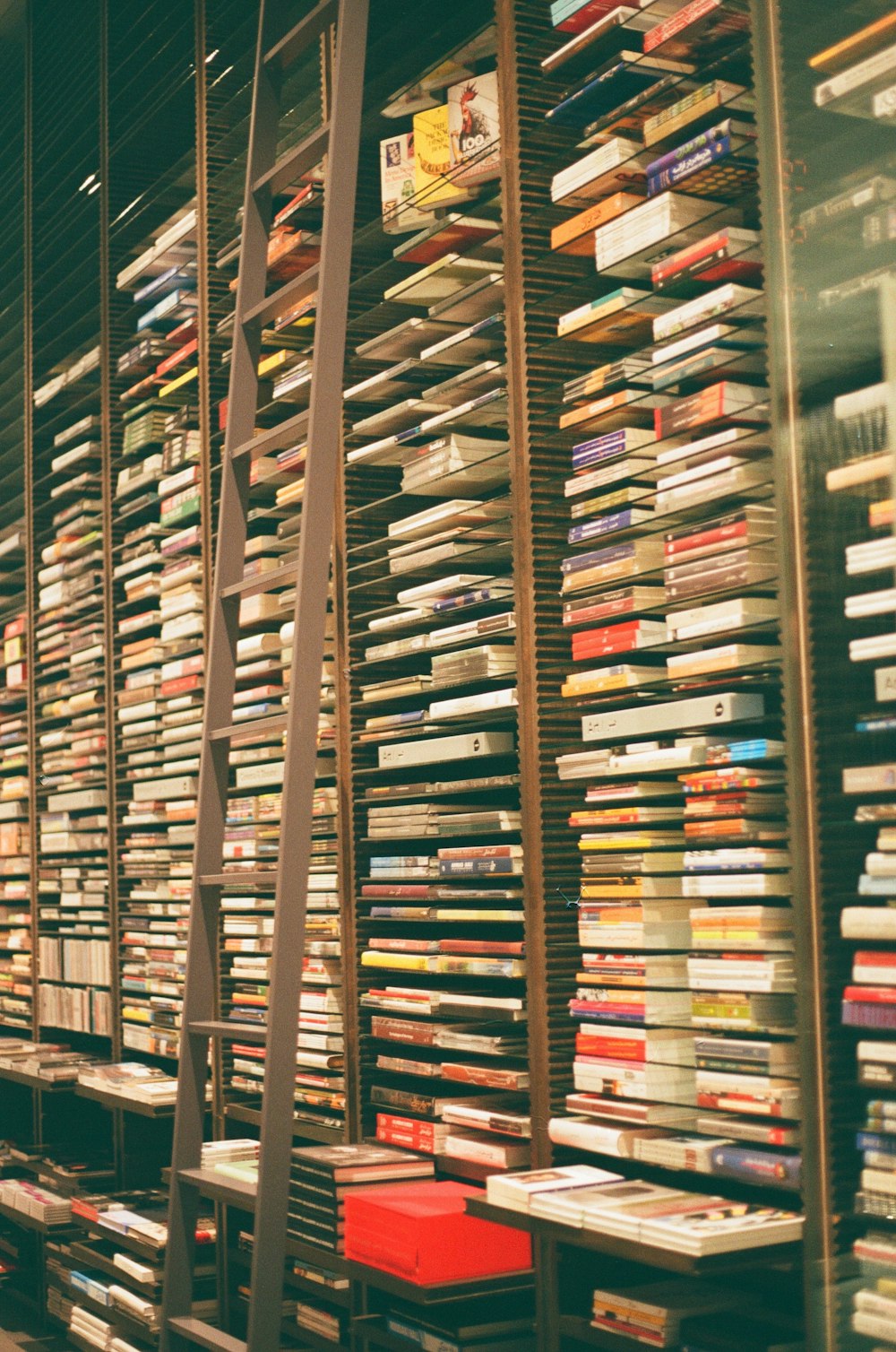 brown wooden book shelf with books