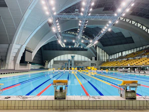 Indoor premium swimming pool sparkling under warm lighting.