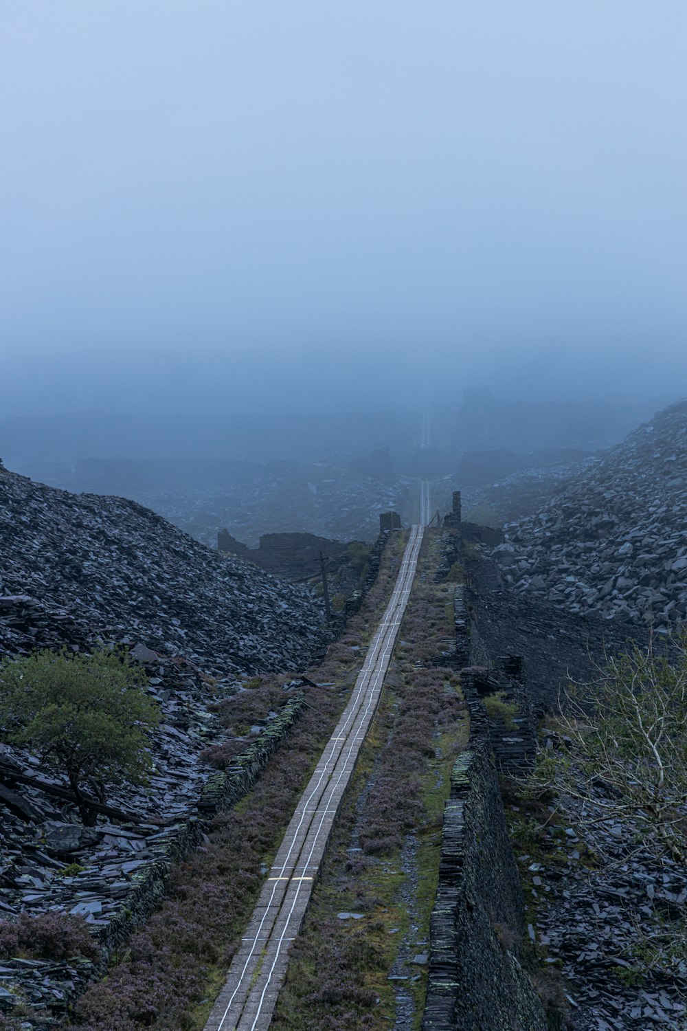 train rail on mountain during daytime