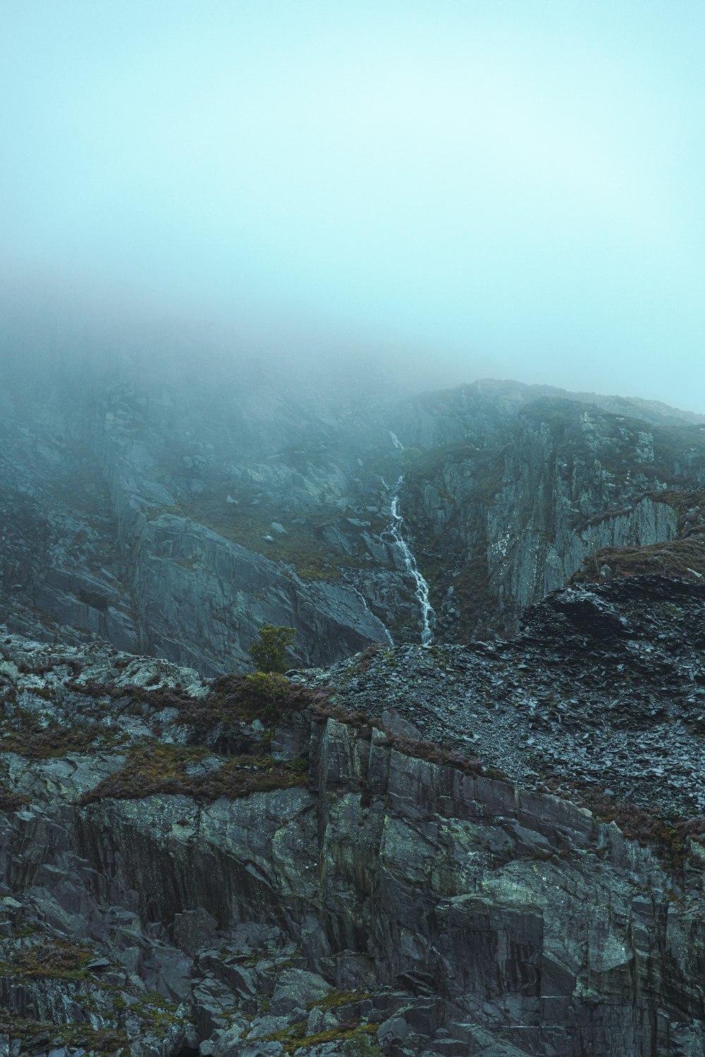 gray rocky mountain under white sky during daytime