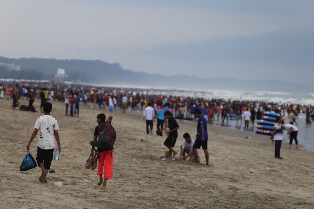 people walking on beach during daytime