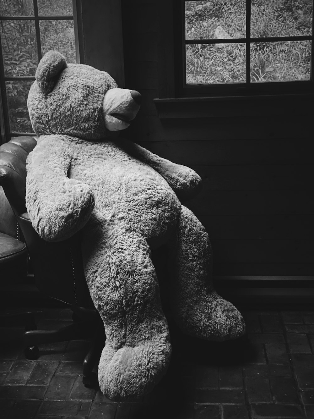 grayscale photo of bear plush toy