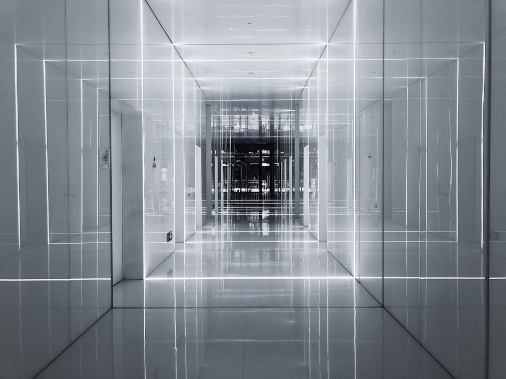 white tiled hallway with white tiled walls