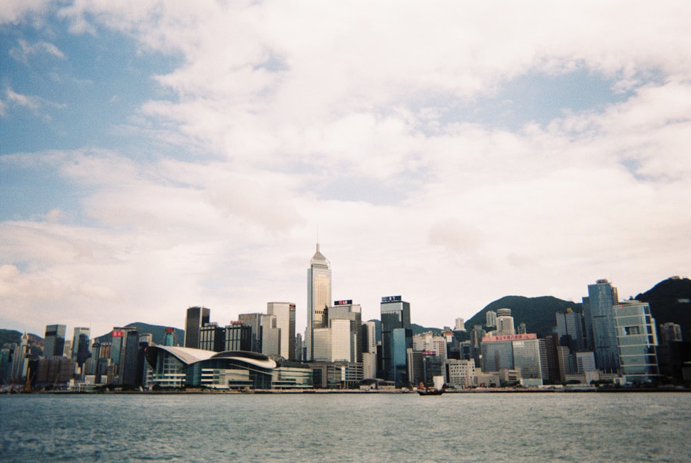 city skyline across body of water during daytime