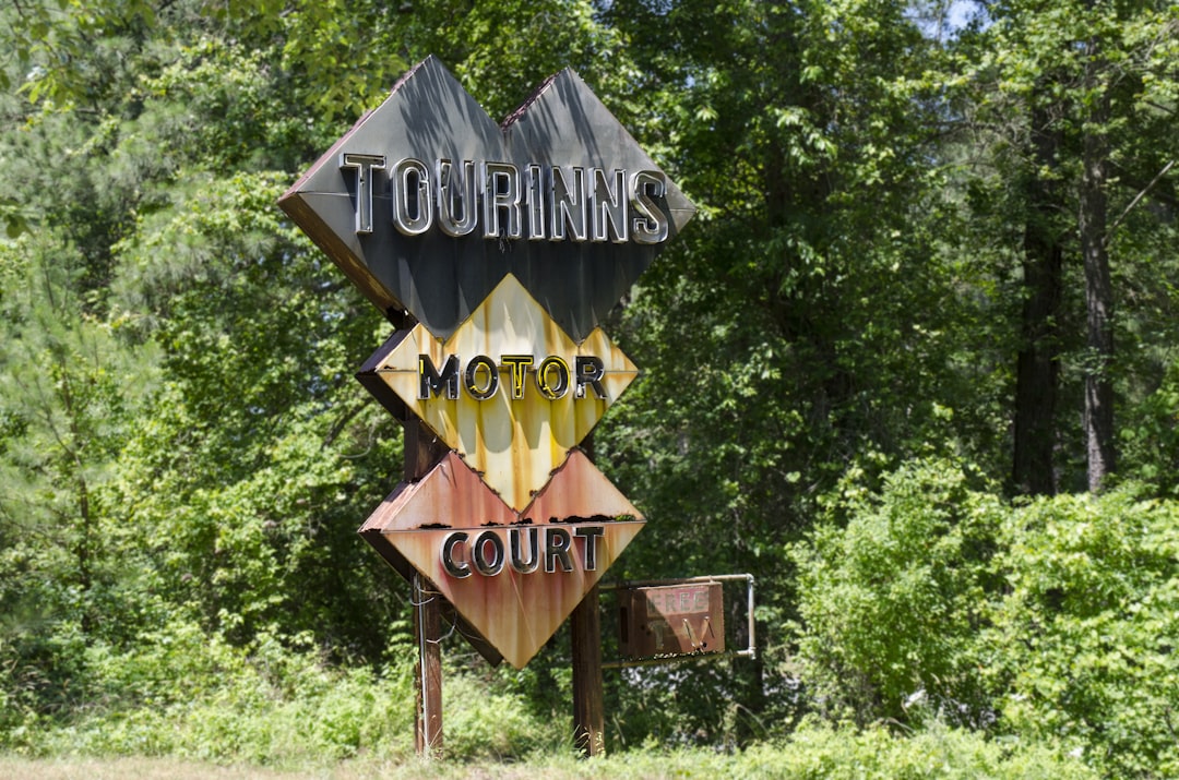 brown wooden welcome to the beach signage, Rare Motor Inn sign from the 1950s