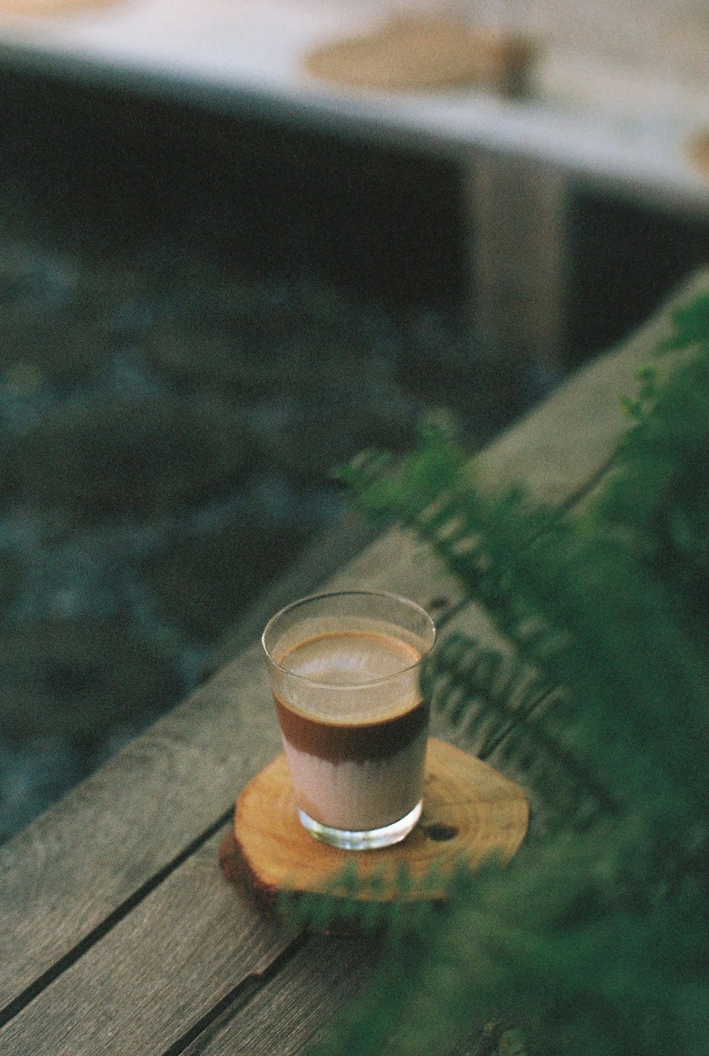 clear drinking glass on brown wooden table