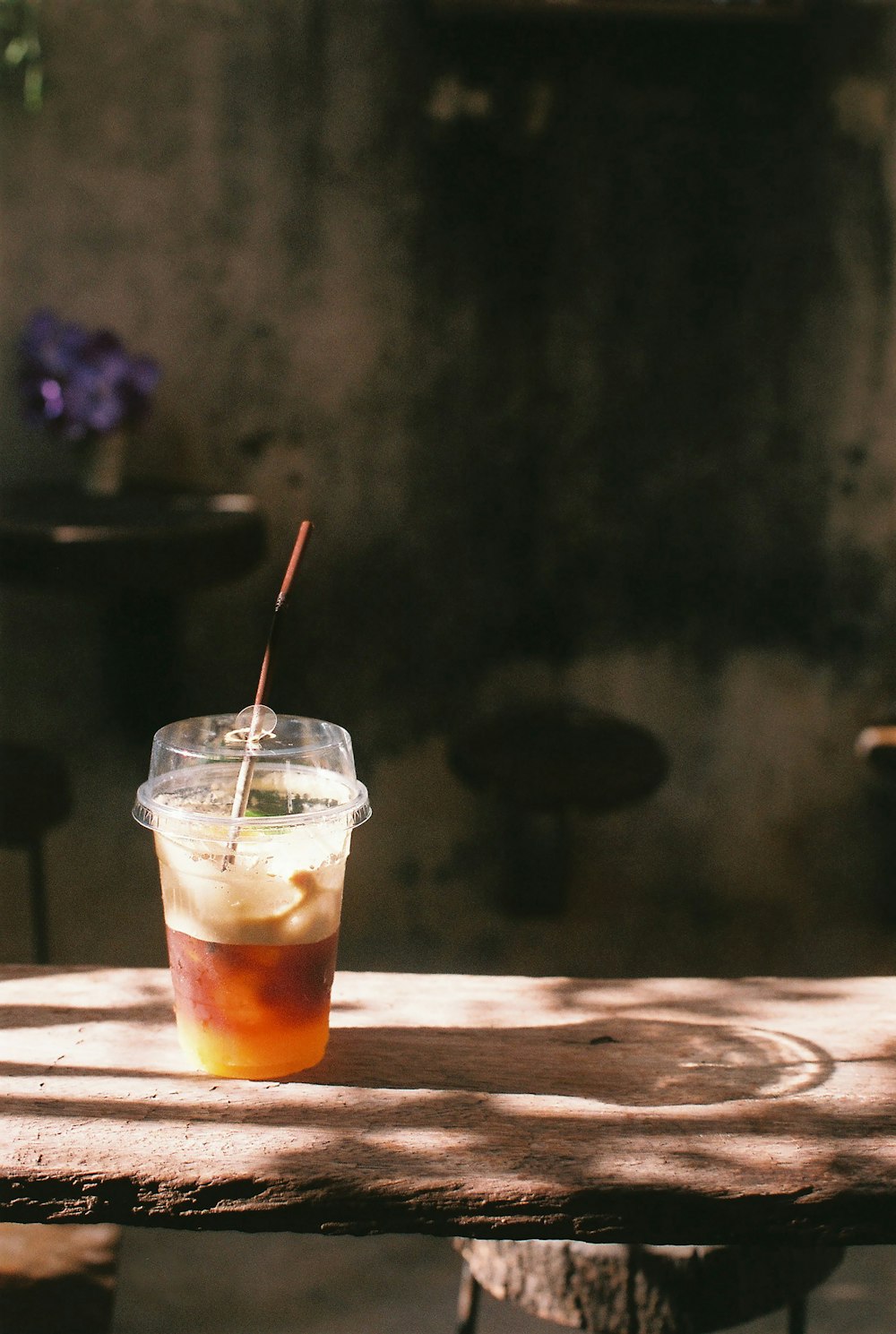 clear drinking glass with orange liquid