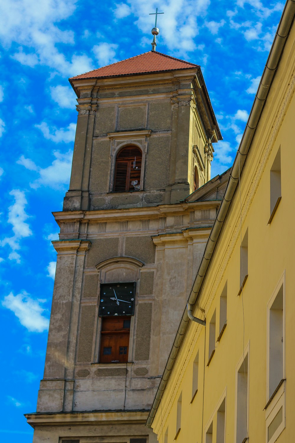 brown concrete building under blue sky during daytime