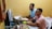 A focused student reviewing a thesis draft on a laptop in a quiet study room.