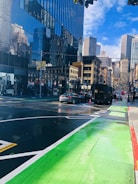 Cityscape with electric delivery vans moving through bike lanes.