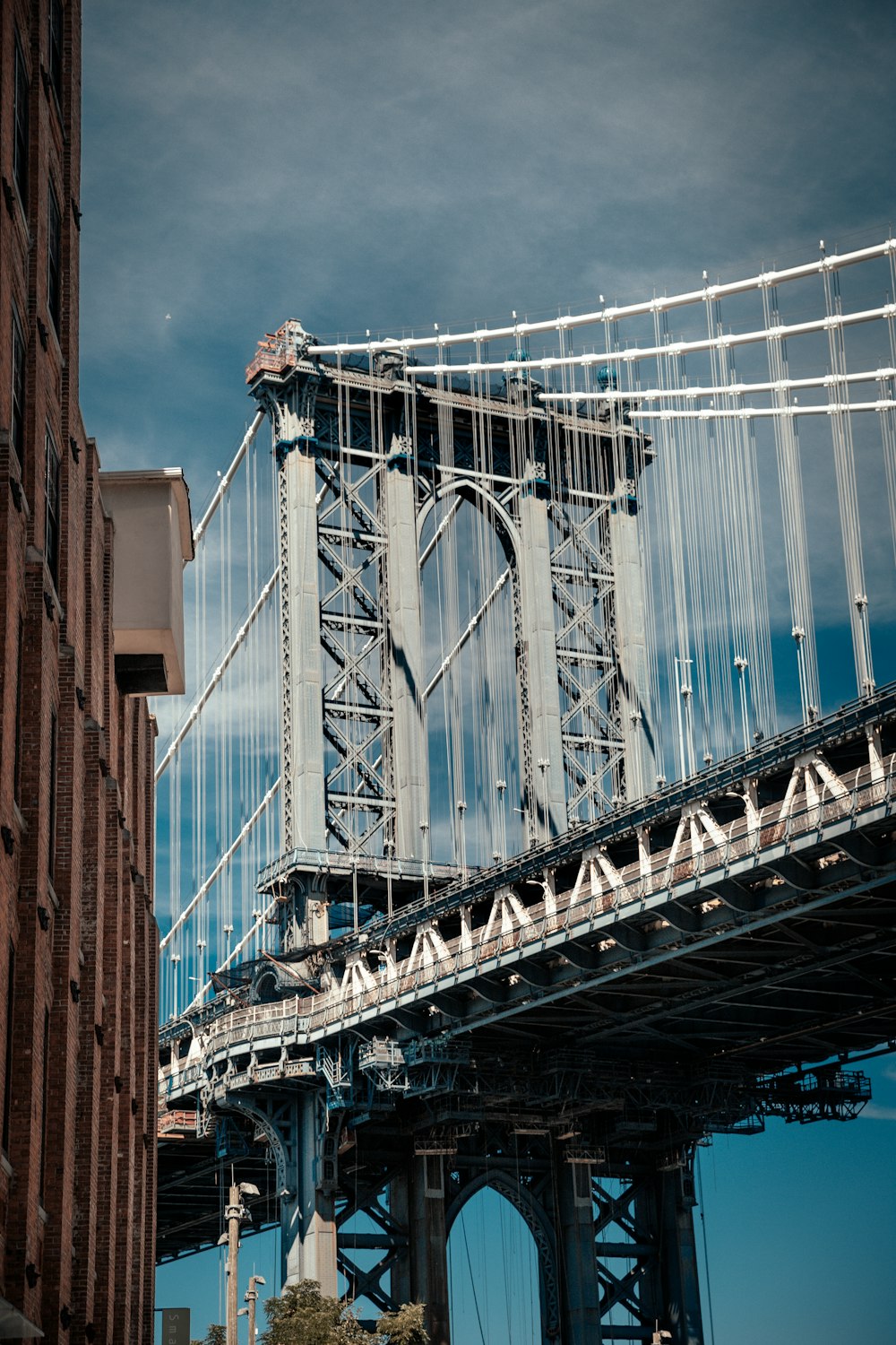 gray bridge under blue sky during daytime