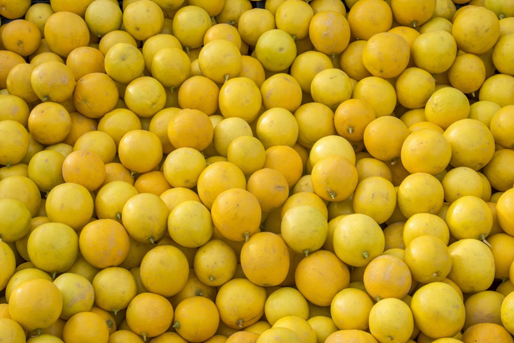 yellow round fruits on white ceramic plate