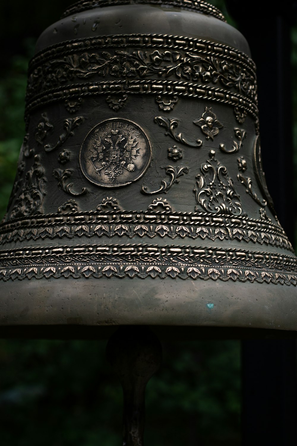 silver steel bell with black handle