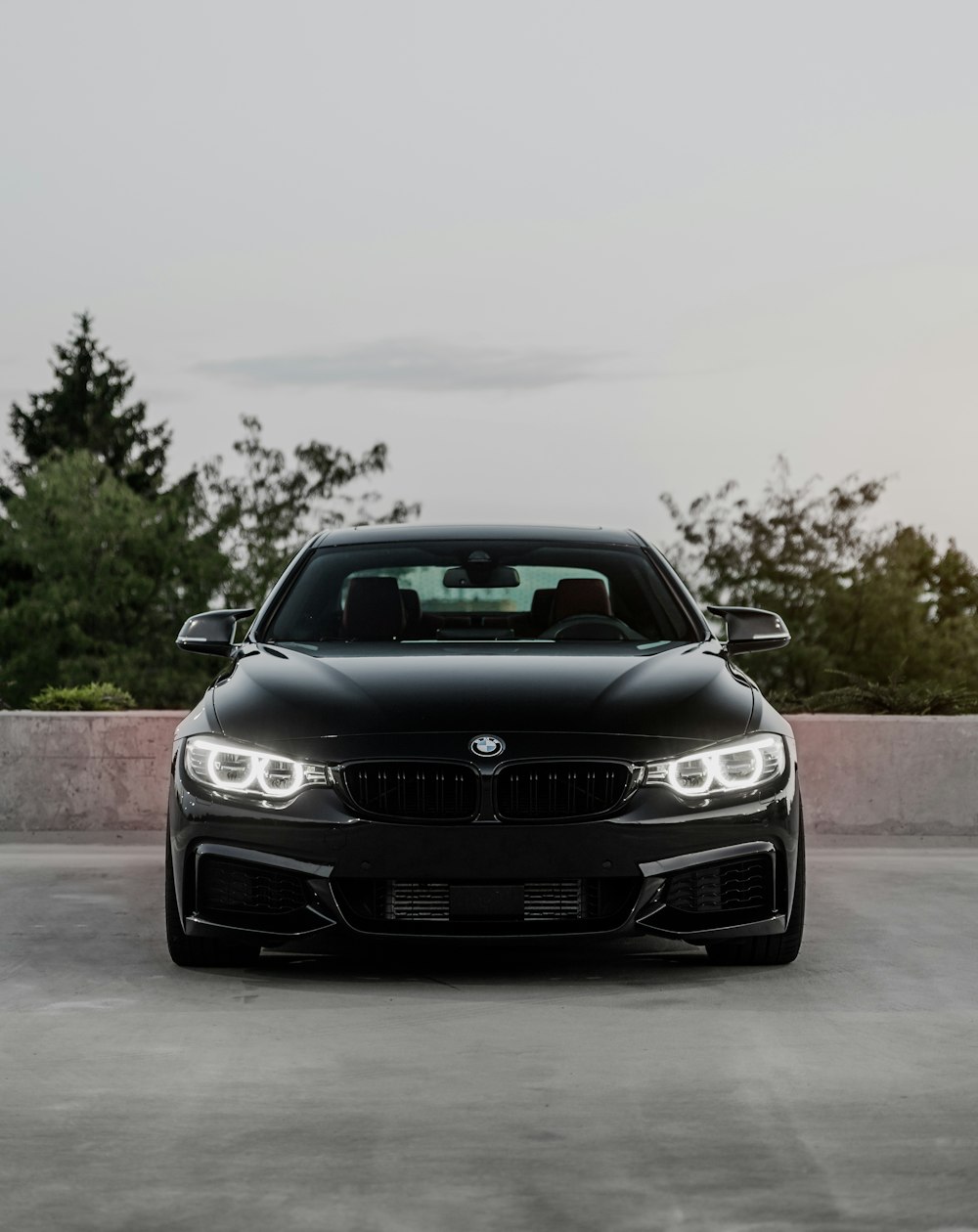 black bmw car on road during daytime