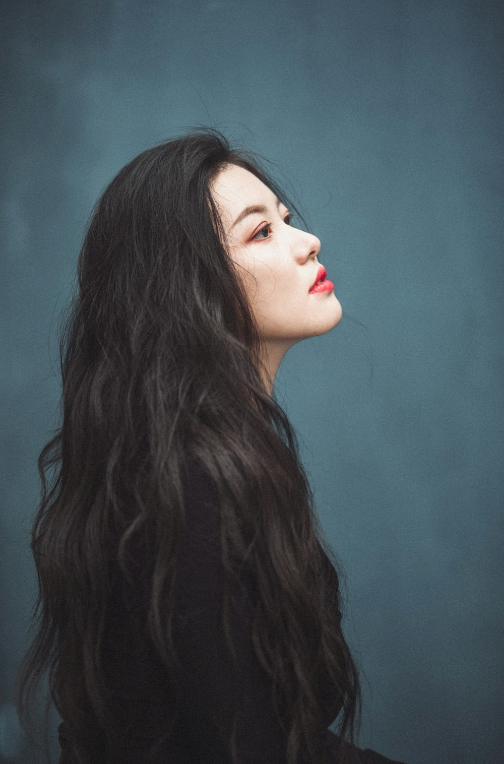 woman with red lipstick and black hair