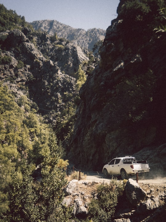 white suv on road near mountain during daytime in Kemer Turkey