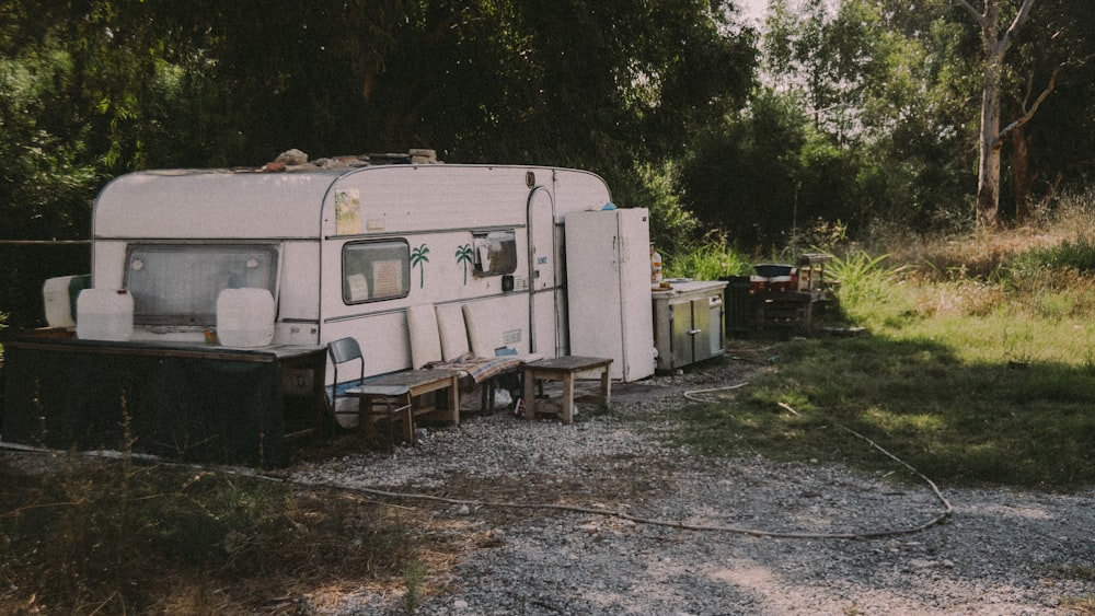 white and brown camper trailer