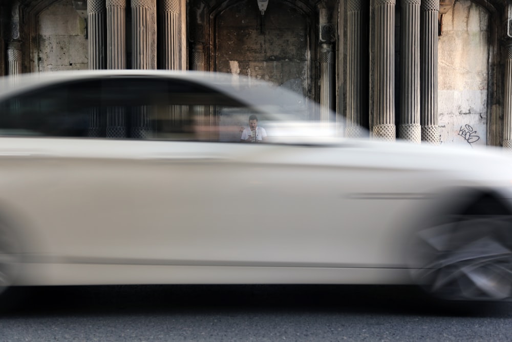 white car parked near building during daytime