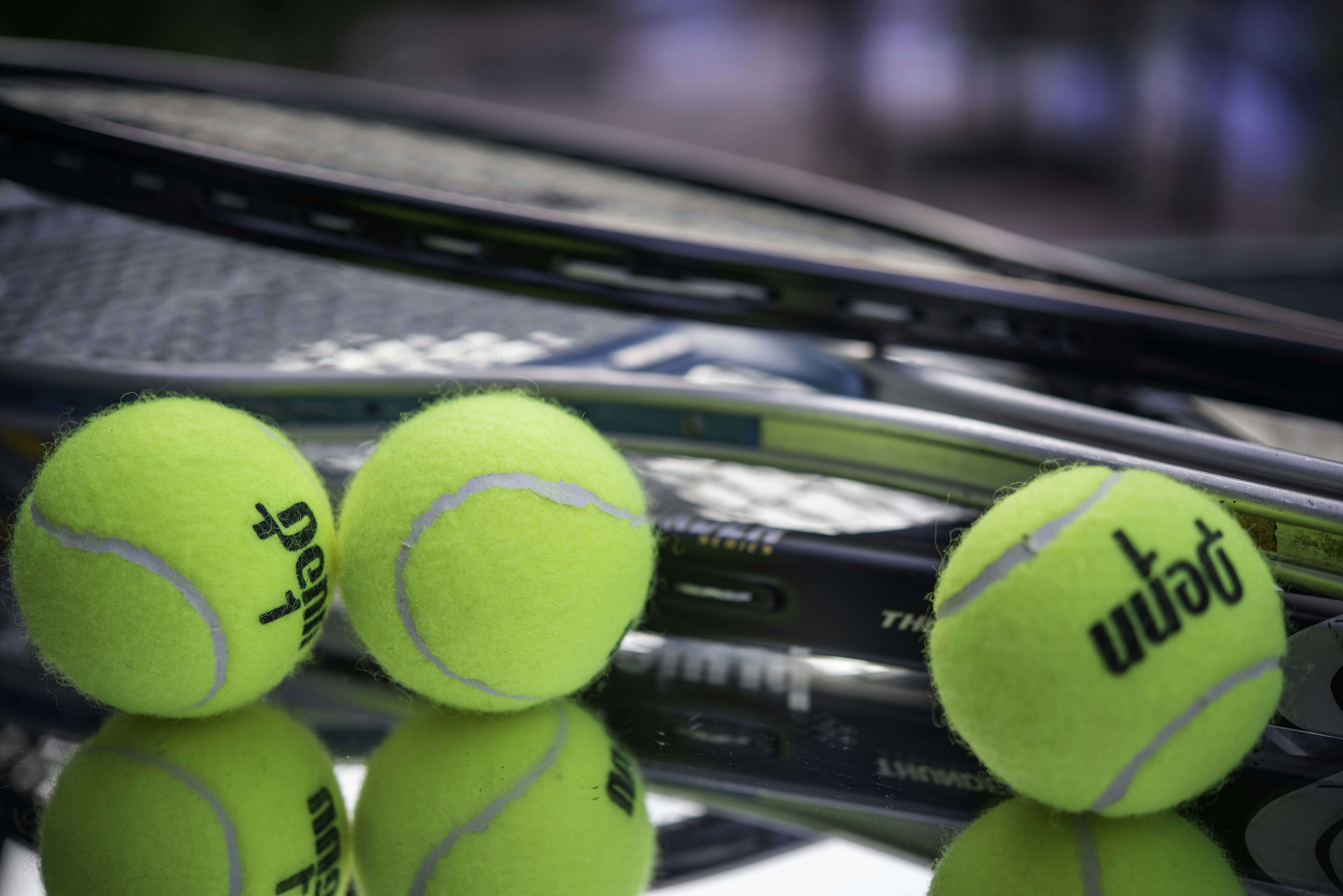 Tennis balls and racquets.